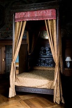 the canopy bed is made up and ready to be used as a room divider