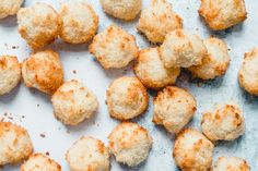 some kind of food that is on a white surface with other foods in the background