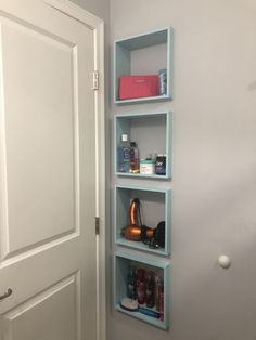 the shelves in the bathroom are filled with personal care items