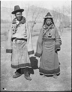 two native american women standing next to each other