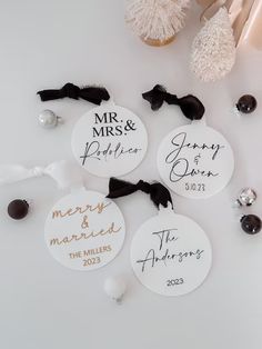 personalized wedding ornament for bride and groom on white background with black ribbon