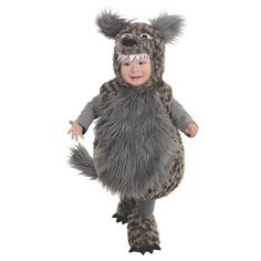 a baby in a costume that looks like a racoon is standing on its hind legs