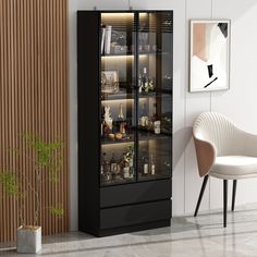 a black cabinet with glass doors and shelves in a living room next to a white chair