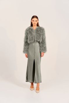 The perfect blend of strong shoulder structure and flattering feminine cropped length, the Marabou feather jacket oozes sophistication and style. Perfect for a chilly winter’s evening, the Manhattan can be dressed up or down no matter the occasion. 100% Marabou Feather outer Satin finish lining Hook and eye clasps at c Chic Cropped Jacket With Faux Fur Trim, Winter Feather Trim Outerwear For Night Out, Winter Outerwear With Feather Trim For Night Out, Long Sleeve Feathered Outerwear For Fall, Feather Trim Outerwear For Night Out In Winter, Long Sleeve Faux Fur Evening Outerwear, Evening Faux Fur Outerwear For Fall, Winter Night Out Outerwear With Feather Trim, Long Sleeve Faux Fur Outerwear For Evening