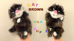 two hand puppets made to look like cats