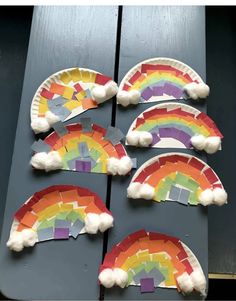 paper plate rainbows with pom - poms on them are ready to be made