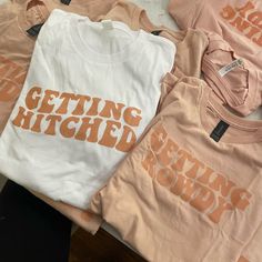 three t - shirts that say getting hitched on the front and back with orange letters