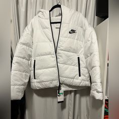 Brand New , White Nike Therma-Fit Puffer Jacket Very Stylish Perfect For The Weather Nike Long Sleeve Outerwear For Outdoor Activities, White Hooded Outerwear For Outdoor Activities, Hooded White Outerwear For Outdoor Activities, Functional White Outerwear For Cold Weather, White Casual Quilted Jacket For Cold Weather, Winter White Long Sleeve Functional Outerwear, Nike Puffer Jacket For Cold Weather, White Sporty Hooded Jacket For Winter Sports, Sporty White Hooded Jacket For Winter Sports