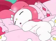 hello kitty is sleeping in her bed with pink sheets