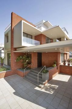 an apartment building with stairs leading up to it