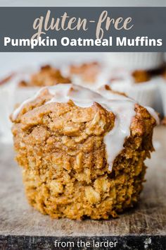 a muffin with icing sitting on top of a cutting board