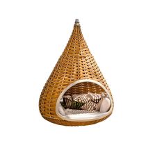 the hanging chair is made out of wicker and has a cushion on it's side