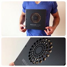 a man is holding a box with circles on it and the bottom one has an open lid