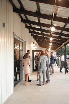 a group of people standing outside of a building