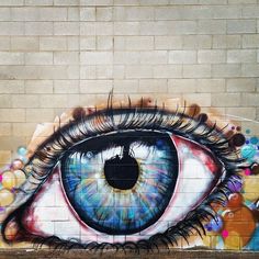 an eye painted on the side of a building