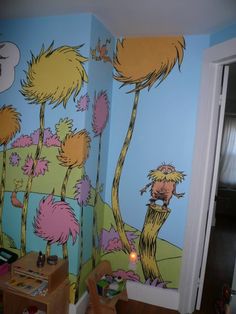 the dr seuss wall mural is painted in a child's room with blue walls