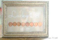 a frame with some coins in it and the word lucky written on it is sitting on a table