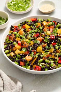 a salad in a white bowl on a table