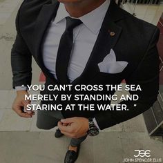 a man wearing a suit and tie with a quote on the side that says, you can't cross the sea medley by standing and staring at the water