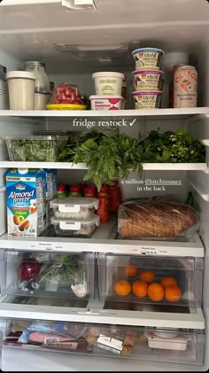 an open refrigerator filled with lots of food and veggies on the shelves in front of it