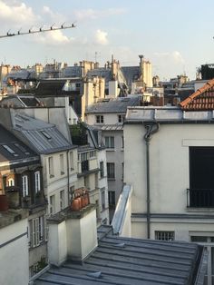 the roofs of buildings are covered with rooftoping sheets and air conditioners in paris, france