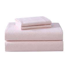 the sheets and pillow cases are folded up on top of each other in pink linens