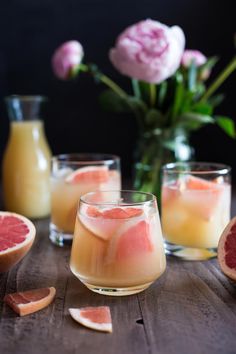 grapefruit and orange juice in glasses on a table