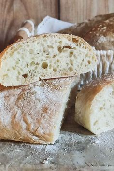 two loaves of bread sitting on top of a table