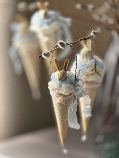 three ice cream cones with bunnies in the shape of bunnies hanging from them