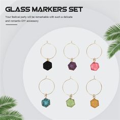 the glass markers set includes six different colors and sizes, including one with a gold hoop