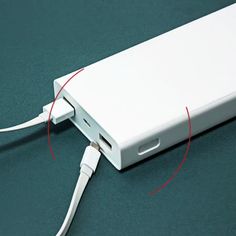 an external hard drive is plugged in to the macbook pro with red wires