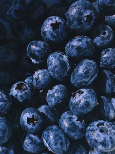 blueberries are piled on top of each other