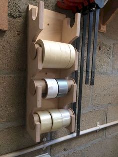 several rolls of tape are hanging on the wall