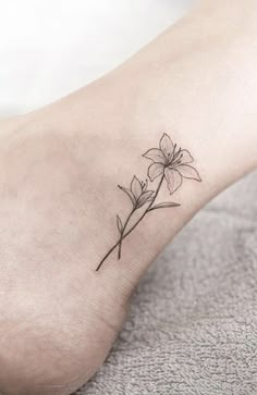 a small flower tattoo on the ankle is one of the most popular tattoos for women