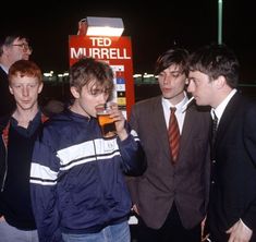 a group of young men standing next to each other