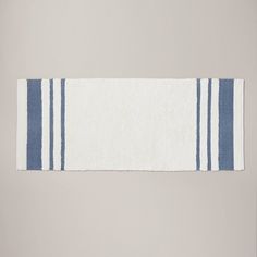 a blue and white towel hanging on the wall