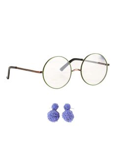 PRICES MAY VARY. Size: Standard Complete your Encanto costume with this Mirabel Glasses and Earrings Set! The officially licensed accessory kit comes with two easy-to-wear pieces. A pair of lightweight, lime-colored wire circle frames set with clear non-prescription lenses give fans Mirabel's signature bespectacled look. The accompanying purple pom-pom dangle earrings are inspired by Mirabel's whimsical style. Glasses And Earrings, Mirabel Costume, Encanto Costume, Cloth Earrings, Glitter Flats, Plastic Glasses, Earring Kit, Circle Frames, Whimsical Fashion