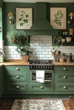 a kitchen with green cabinets and white subway backsplash, potted plants on the stove