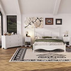 a white bed sitting on top of a wooden floor next to a dresser and mirror