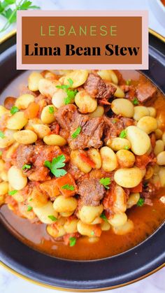 a plate filled with beans and meat on top of a table