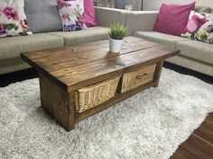 a living room with couches and a coffee table in the middle on a shaggy rug