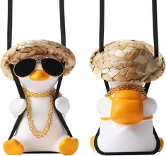 two ducks wearing hats and sunglasses with chains around their necks, one in the shape of a duck