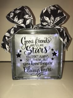 a glass block with a bow on top that says good friends are like stars you don't always see them but you know they are always there