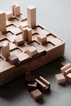 a wooden puzzle with pieces missing from it