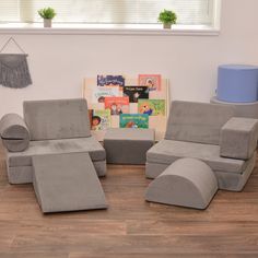 a living room filled with furniture and a blue cake on top of a wooden floor