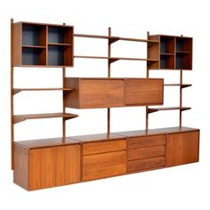 a wooden shelf with drawers and shelves on it's sides, against a white background