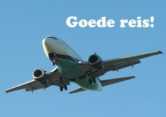 an airplane is flying in the sky with words goede reis