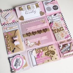 a pink and gold scrapbook with lots of stickers on it's cover