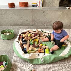 a toddler playing with toys on the floor