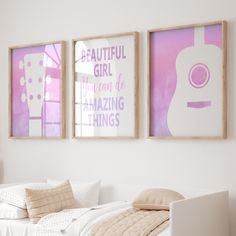 two framed pictures hang on the wall above a bed